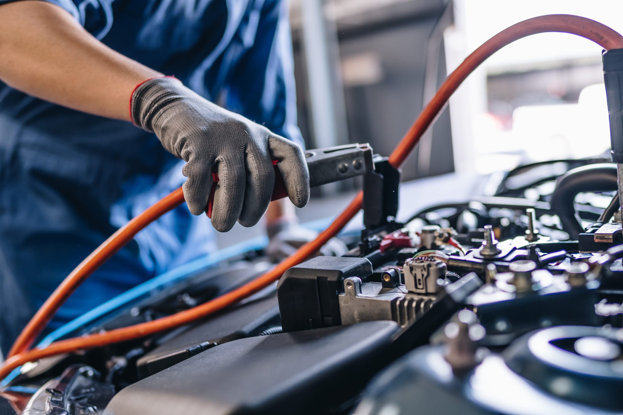 Maintenance worker checking tire service via insurance system at garage, Safety vehicle to reduce accidents before a long travel, road trip transportation.